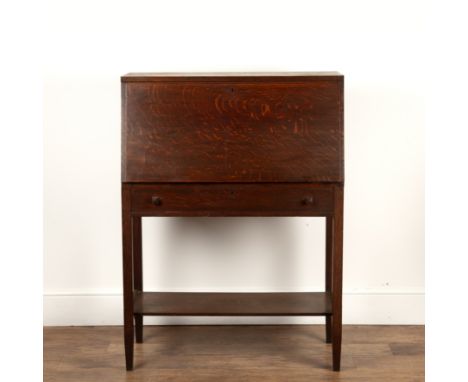 Arts and Crafts oak, bureau, the sloped fall front enclosing a compartmented interior above a long drawer above a shelf, 87cm