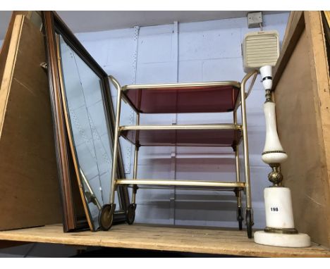 Two mirrors, a trolley and a lamp