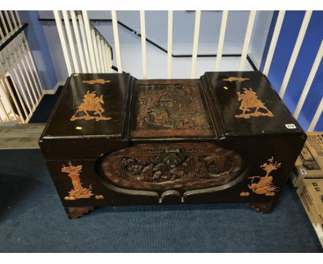 A carved Oriental trunk