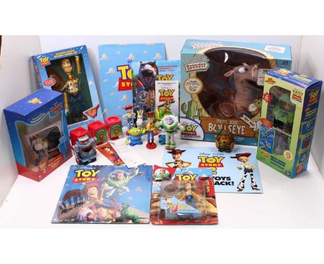 Two trays of Toy Story related action figures and boxed sets to include electronic talking Woody, model kit, Aqua Buzz Lighty