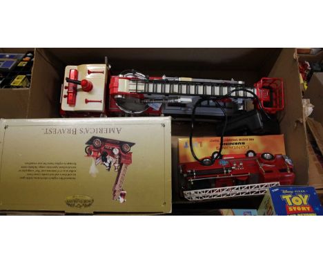A box of radio controlled battery operated fire engine, together with a London's Burning Fire Engine ornamental teapot and Go