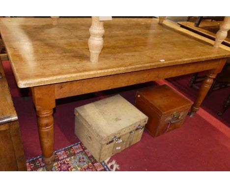 A Victorian light oak farmhouse kitchen table raised on turned slightly tapering supports, length 177cm