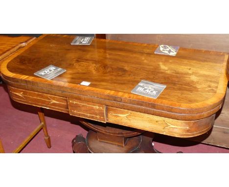 A Regency rosewood satinwood cross banded and further inlaid D-shaped foldover baize lined card table, having a swivel action