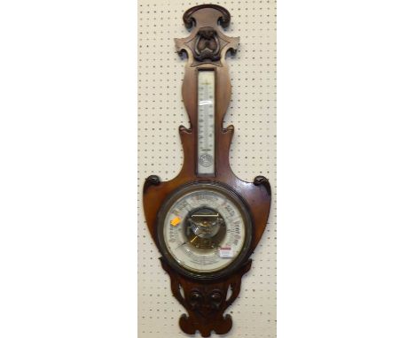 An Art Nouveau mahogany two-dial aneroid wheel barometer, height 85cmSignificant cracks and damage to circular inset glass
