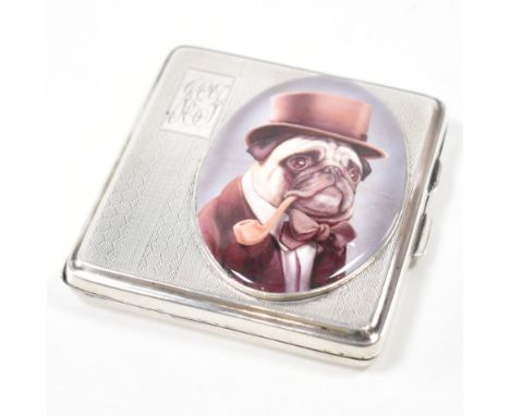 A hallmarked silver cigarette case. The case having engine turned design to front &amp; back, personalised engraving to top l