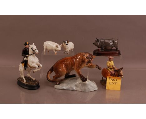 A collection of assorted Beswick ceramic figures,  including a mounted figure, Jamaican lady on a donkey, a pig, a horned she