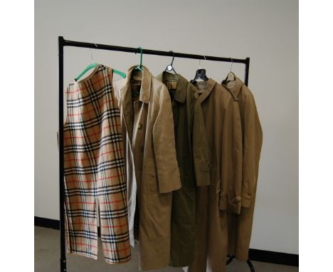 Four Burberry coats, an additional liner and handbag, two men's and two women's coats (6)