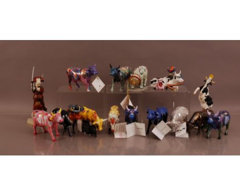 A collection of ceramic Cow Parade cows, comprising an assortment of cows, some American related examples (15)