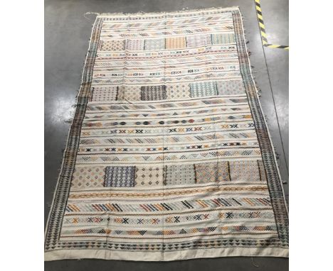 A 20th century light coloured kilim rug, possibly Greek or Cypriot, 289cm x 188cm