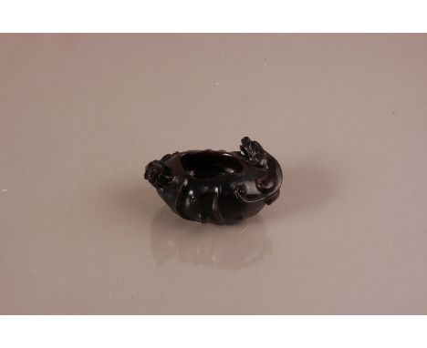 A mid 20th century Chinese carved boxwood item, 11cm wide, having two dragon style creatures