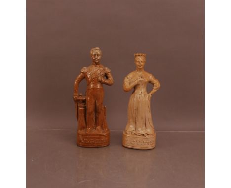 A pair of 19th century saltglazed ceramic decanters,  of Queen Victoria and Prince Albert, 29.5cm and 31cm high, both AF, Que