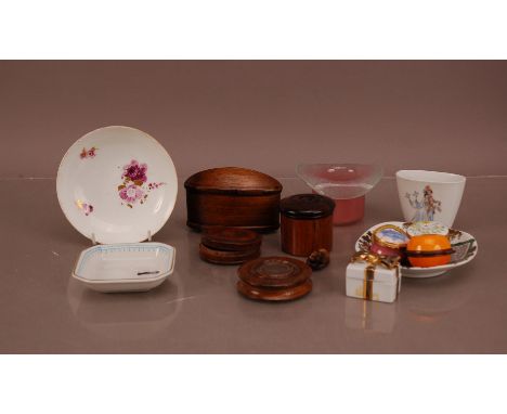 A collection of ceramic and treen collectables, including wooden storage containers, a glass hat ornament, a ceramic Meissen 