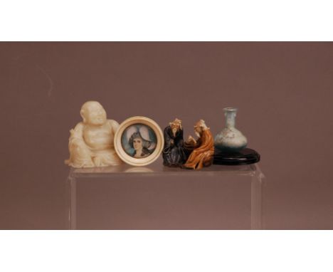 Four works of art, comprising, a hardstone figure of a buddha 6.5cm high, a portrait miniature of a lady 5cm diameter, an ant