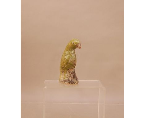 An early 19th century 'Diana Cargo' glazed ceramic Parrot, 15.5cm high green glaze (worn), Provenance Christies: The Diana Ca