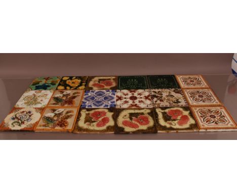 A collection of ceramic tiles, of differing designs, some deeper than others (18)
