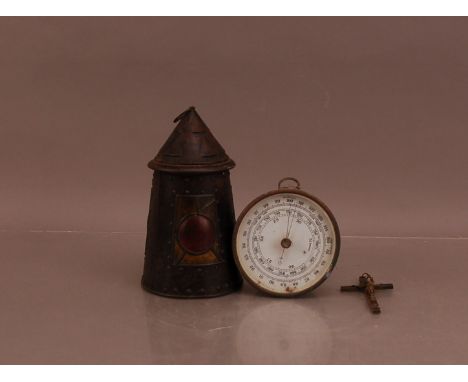 An early 20th century metal cased barometer, 13cm diameter, AF, together with an arts and craft biscuit tin 22cm high, and sm