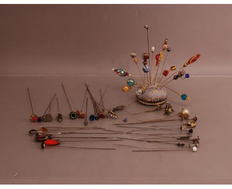 A large collection of hat pins,  including ceramic, enamel and metal varieties (qty)