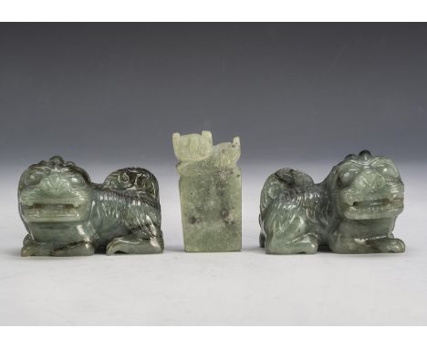 A pair of Chinese quartzite Buddhistic lion dogs, 6.2cm x 4cm, together with a late 20th century similar seal 5.2cm (3)