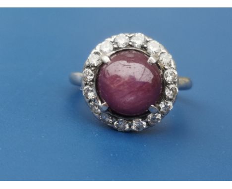 A star ruby &amp; diamond circular cluster ring in white metal.  Finger size N.