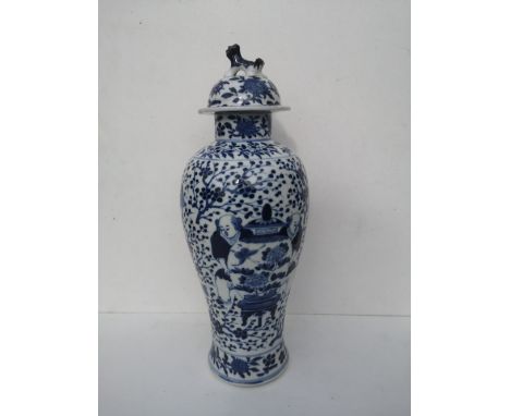 A Chinese blue &amp; white porcelain meiping covered vase, having overall decoration depicting two men holding a large vase t