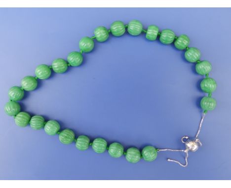 A carved jade bead necklace with 925 spherical clasp, 21" - untested for dye.