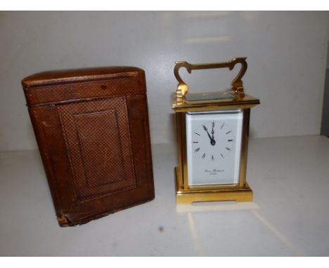 A modern English brass carriage clock by Thos. Braithwaite, 4.25" high excluding handle, in old carrying case.