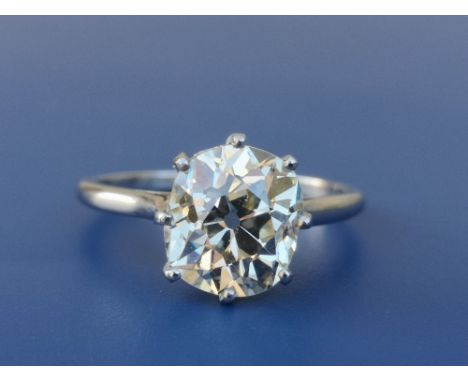 A certified natural light yellow 3.75 carat old cushion cut diamond solitaire, the claw set stone on 'PLAT' shank, accompanie