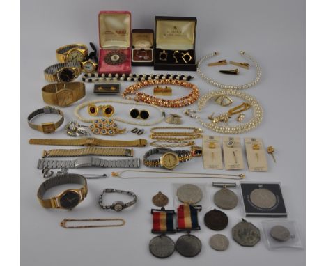 A quantity of assorted costume jewellery, wristwatches, medals and sundries. To include a vintage Ingersoll, Accurist, chains