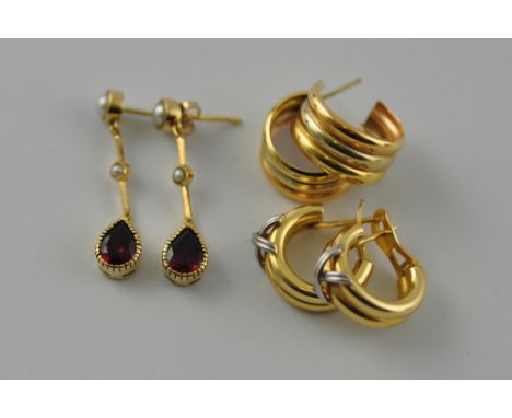 A pair of 18ct gold pearl and ruby drop earrings, together with a pair of 18ct gold earrings, and a pair of yellow metal earr