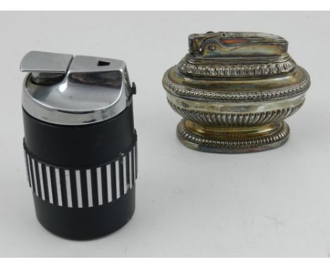 A Ronson white metal Queen Anne table lighter, together with one other Ronson lighter