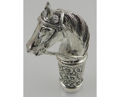 A novelty silver plated walking stick handle in the form of a horse's head. 