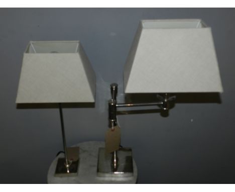 A chrome table lamp, with adjustable top, with cream shade, together with another chrome table lamp. H. 69cm(2) 