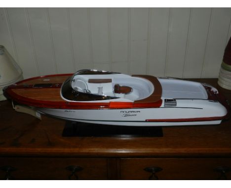 A scale model of an Aqua Riva power boat with hardwood decking and white hull. L. 90cm