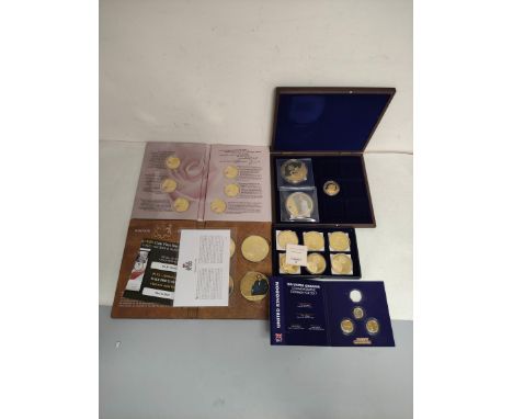 Collector's commemorative coin sets by the Windor Mint. To include Great Britain At War Winston Churchill gold plated set, El