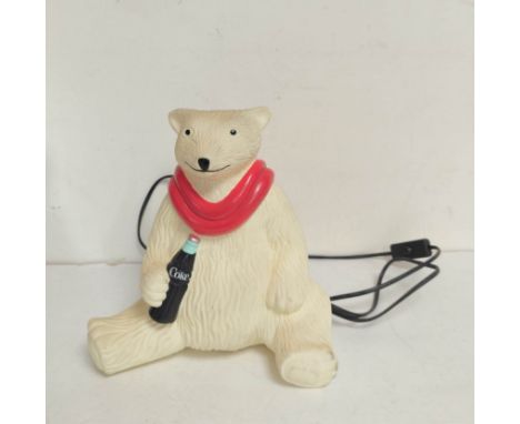 Vintage 1990s Coca Cola polar bear, 240v table lampn of plastic construction with painted red scarf and cola bottle.