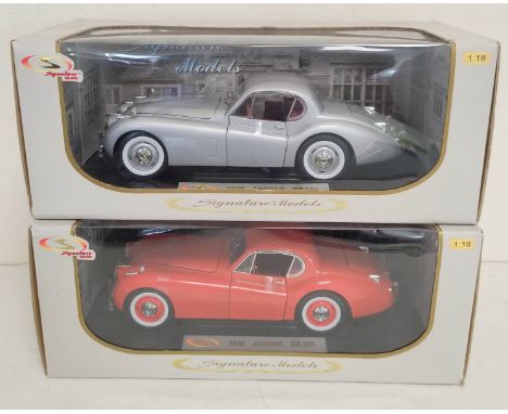 Two Signature Models 1:18 scale boxed die cast model vehicles. To include a 1949 Jaguar XK120 in silver, the other in red. (2