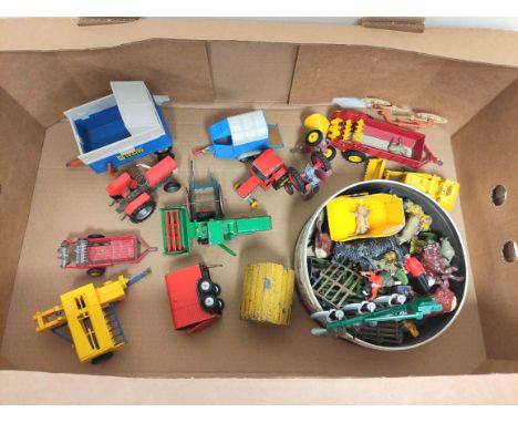 Box containing a quantity of vintage die cast farmyard toys to include Dinky, Lesnie etc. 