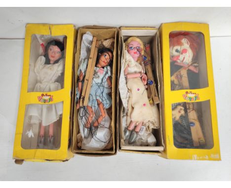 Four vintage Pelham Puppets marionettes to include a late 1960s Bimbo the Clown, Ballet Dancer etc. (4)Condition:Boxes bashed