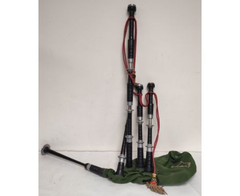 Vintage Highland bagpipes with pewter mounts and synthetic Canmore bag. Unattributed