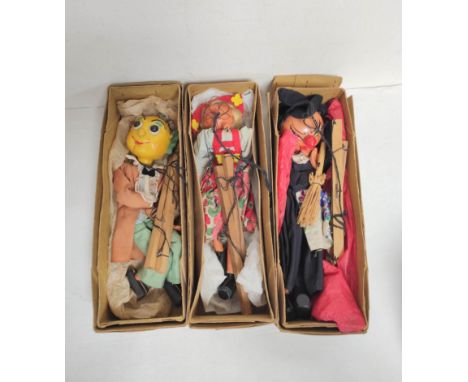 Three vintage boxed Pelham Puppets marionettes to include Mr Turnip, Witch etc. (3) Condition:Boxes creased, stained and torn