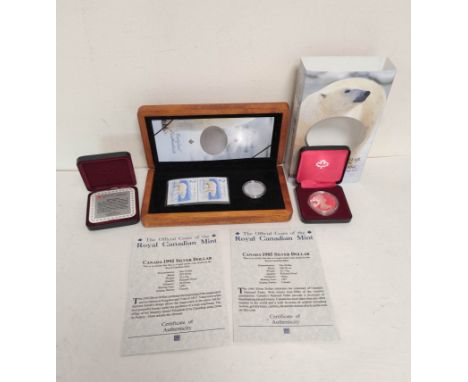 Canada. Three proof silver commemorative coins to include 1985 &amp; 1992 silver dollars and a boxed 2004 silver $2 coin and 