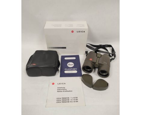 Leica 10x42 BA binoculars in olive green finish with micro-adjustment focusing wheel complete with rear lens caps. Fitted in 