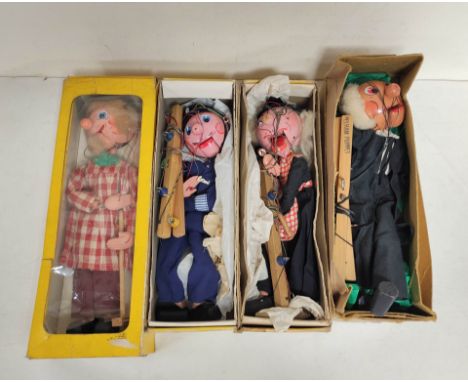 Four vintage Pelham Puppets marionettes to include Schoolmaster (lacking mortarboard hat), Policeman, Witch etc. (4) Conditio