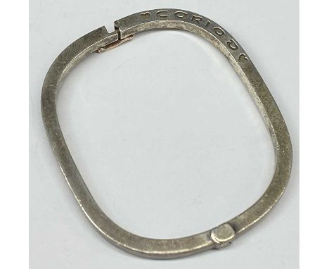 CLOGAU WELSH SILVER 'CARIAD' HINGED BANGLE of rounded rectangular form, with rose gold clasp, 60 x 50mms internalProvenance: 