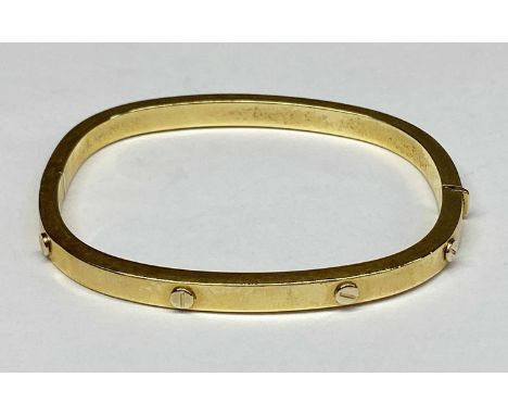GOLD HINGED BANGLE of rounded rectangular form, stamped '750 Italy', 60 x 50mms internal, 14gmsProvenance: deceased estate Co