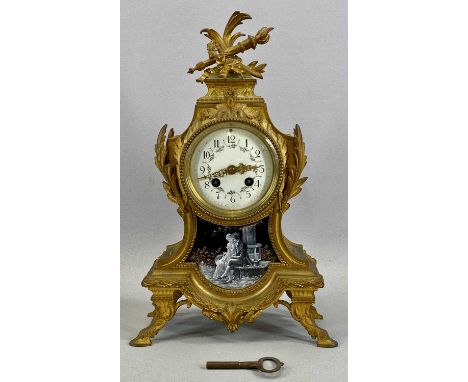 FRENCH GILDED BRONZE MANTEL CLOCK with circular enamel dial, decorated with flowers and with black Arabic numerals, over pâte