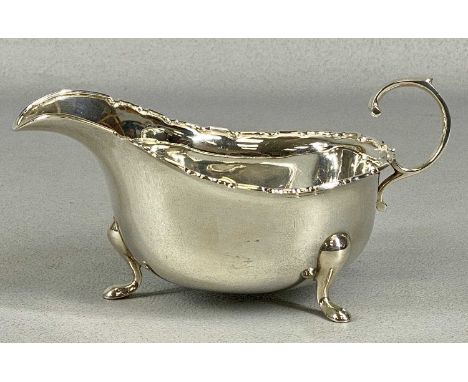 GEORGE V SILVER SAUCEBOAT with shaped rim and loop handle, on pad feet, Adie Brothers Ltd., Birmingham 1933, 5oztProvenance: 