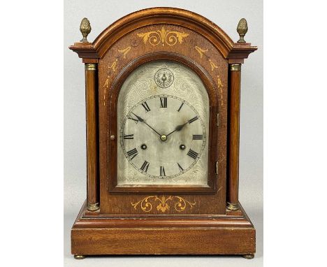 EDWARDIAN INLAID MAHOGANY MANTEL CLOCK, dome top, having pineapple finials, arched silvered dial with black Roman numerals an