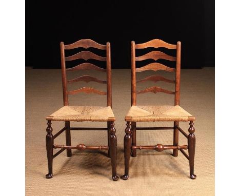 A Pair of Elegant Late 18th/Early 19th Century Fruitwood Rush-seat Ladder-back Side Chairs. The five graduated hump-topped ba