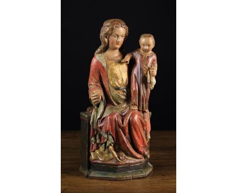 A 17th Century Polychromed Wood Carving of the Enthroned Virgin &amp; Child. Mary depicted with golden hair wearing a red clo